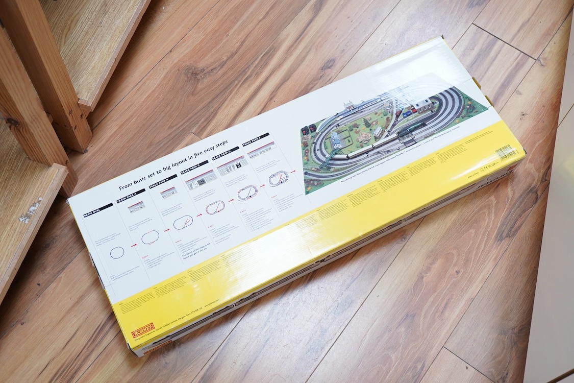 A Hornby Hobbies Eurostar train set (R1013), comprising of a four car train and track mat (track sections and controller etc. missing)